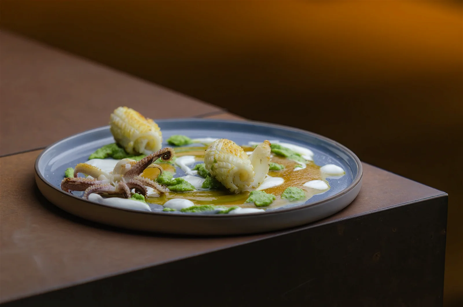 Calamaro con crema di broccoli, vellutata gialla e fonduta di parmigiano